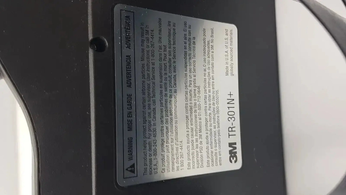 Black 3m versaflo tr-301n+ adhesive tape label with white text and warning symbol for tr-300n+ respirator