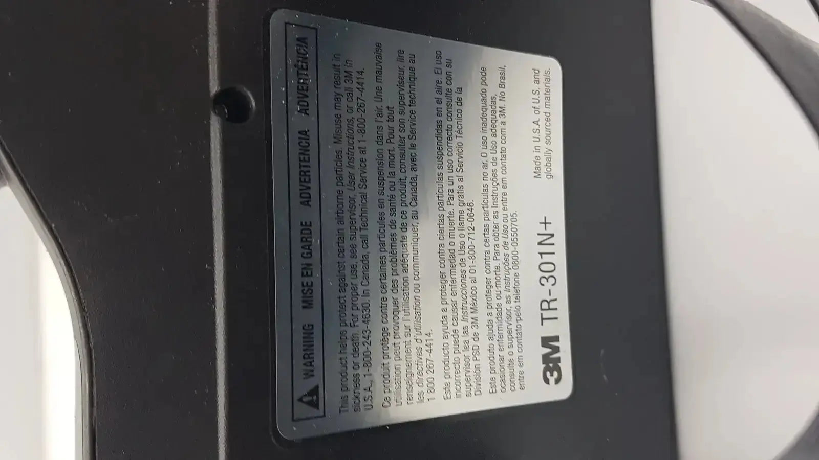 Black 3m versaflo tr-301n+ adhesive tape label with white text and warning symbol for tr-300n+ respirator