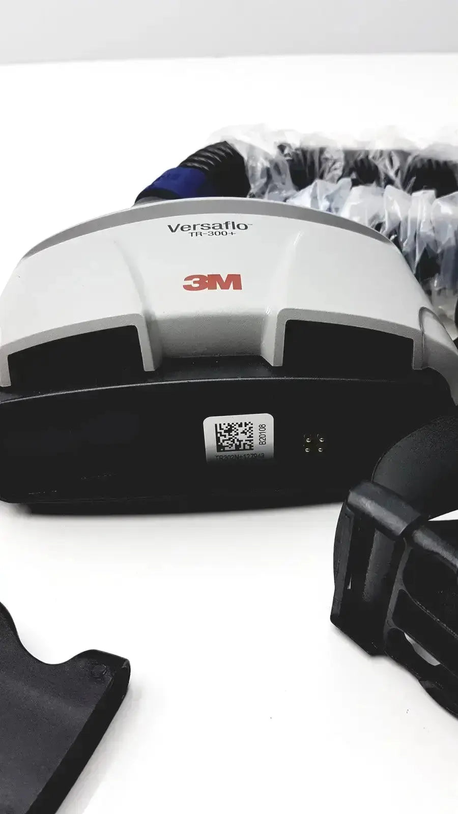 White and black 3m versaflo tr-300+ powered air purifying respirator with a sleek ergonomic design for medical use
