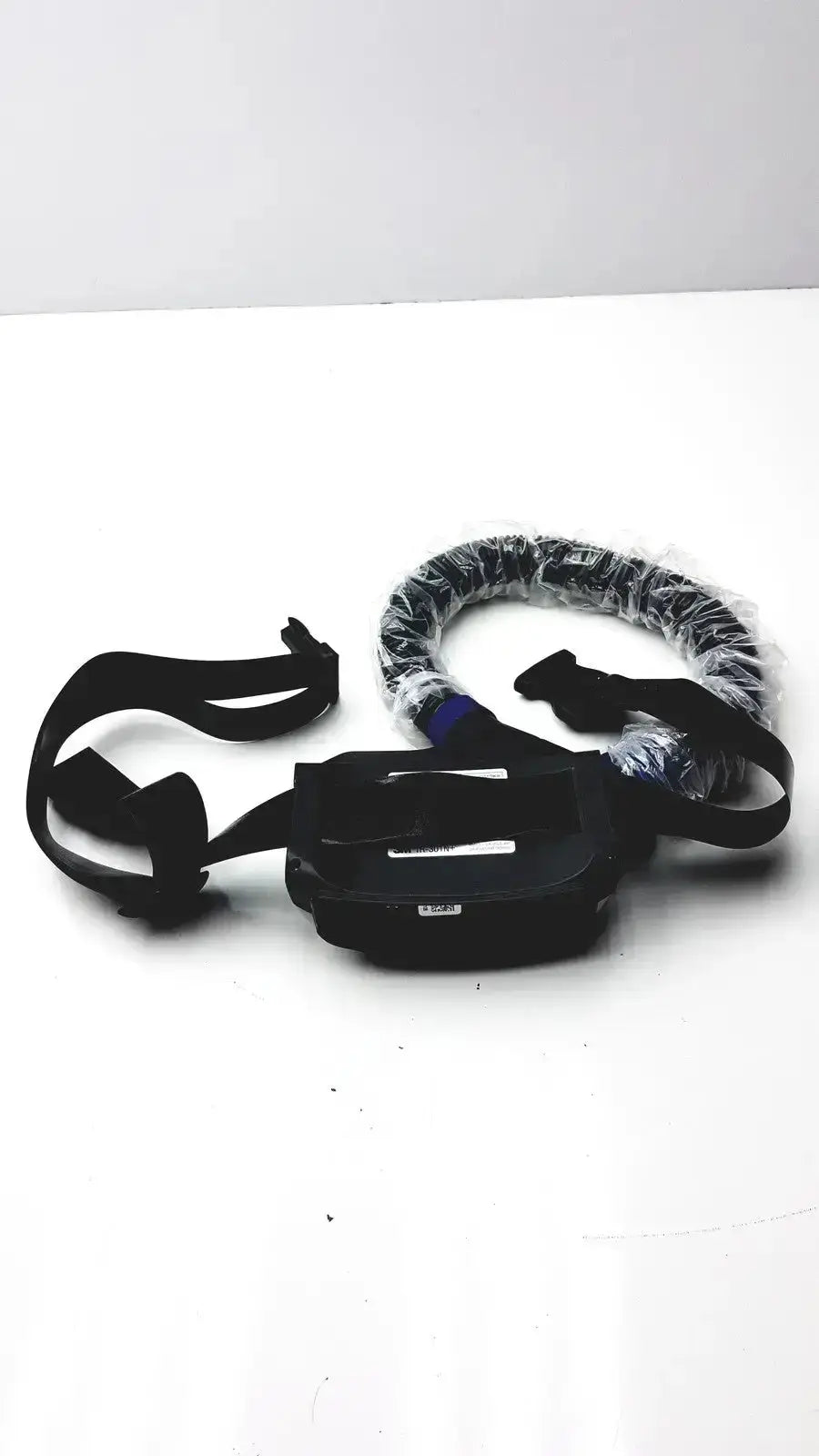 Black plastic headband with adjustable straps and central clip wrapped in protective film for versaflo tr-300+ pre owned medical equipment