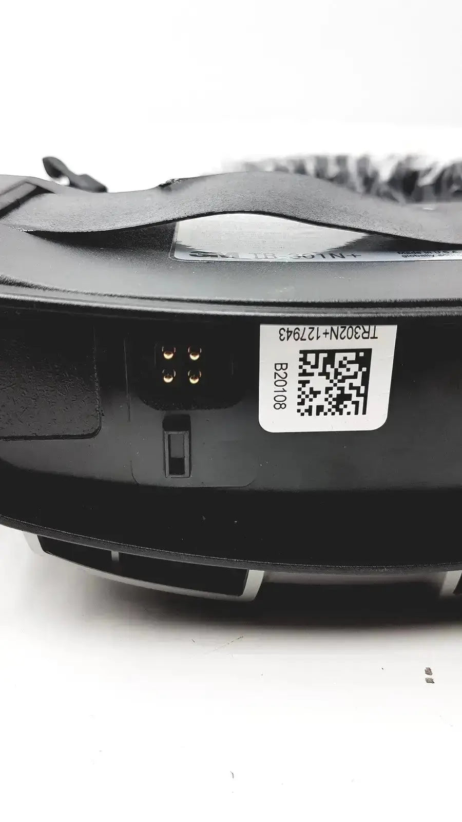 Black plastic versaflo tr-300+ blower with qr code label and metallic connectors shown from the back side for medical use