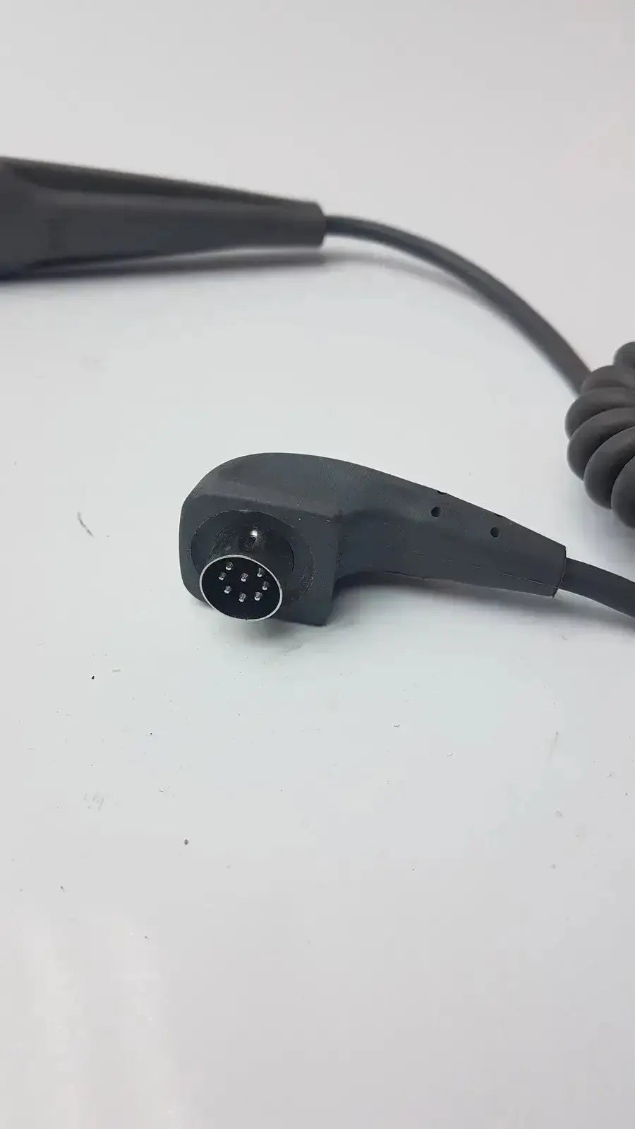 Black coiled cable with molded connector housing featuring 9-pin circular port for arjo lift 4-button handset g-bbde2-30n