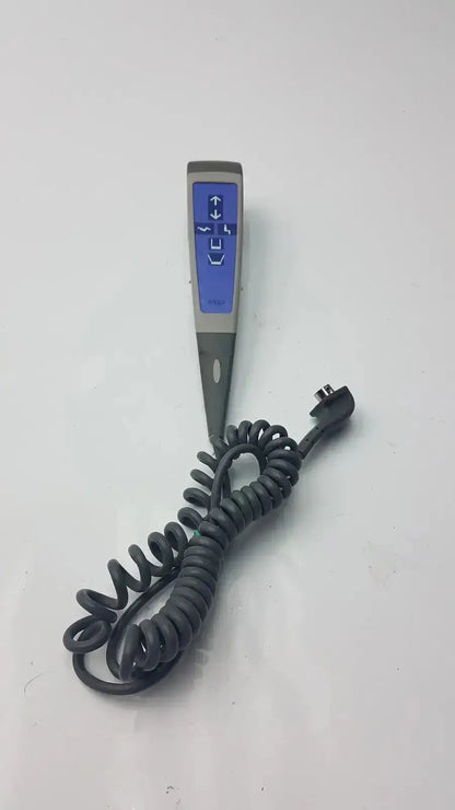 Gray 4-button wired handset for arjo lift with blue digital display and directional arrows connected by coiled black cable