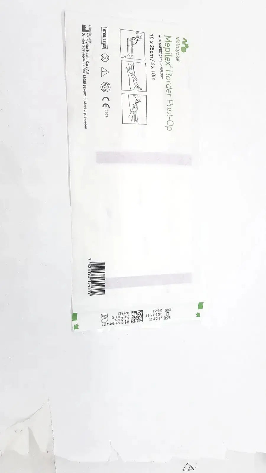 White sterile mepliex border post-op bandage package with green accents and printed product instructions front view