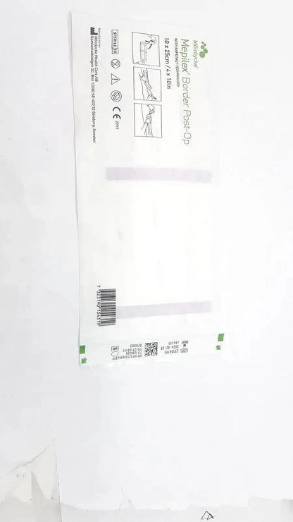 White sterile mepliex border post-op bandage package with green accents and printed product instructions front view