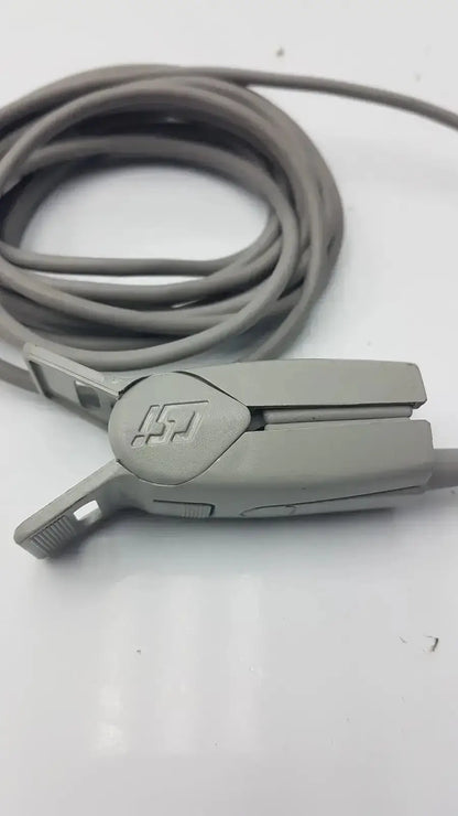 Gray plastic 6-pin spo2 finger clip with coiled gray finger clip cable and embossed logo on clamping mechanism