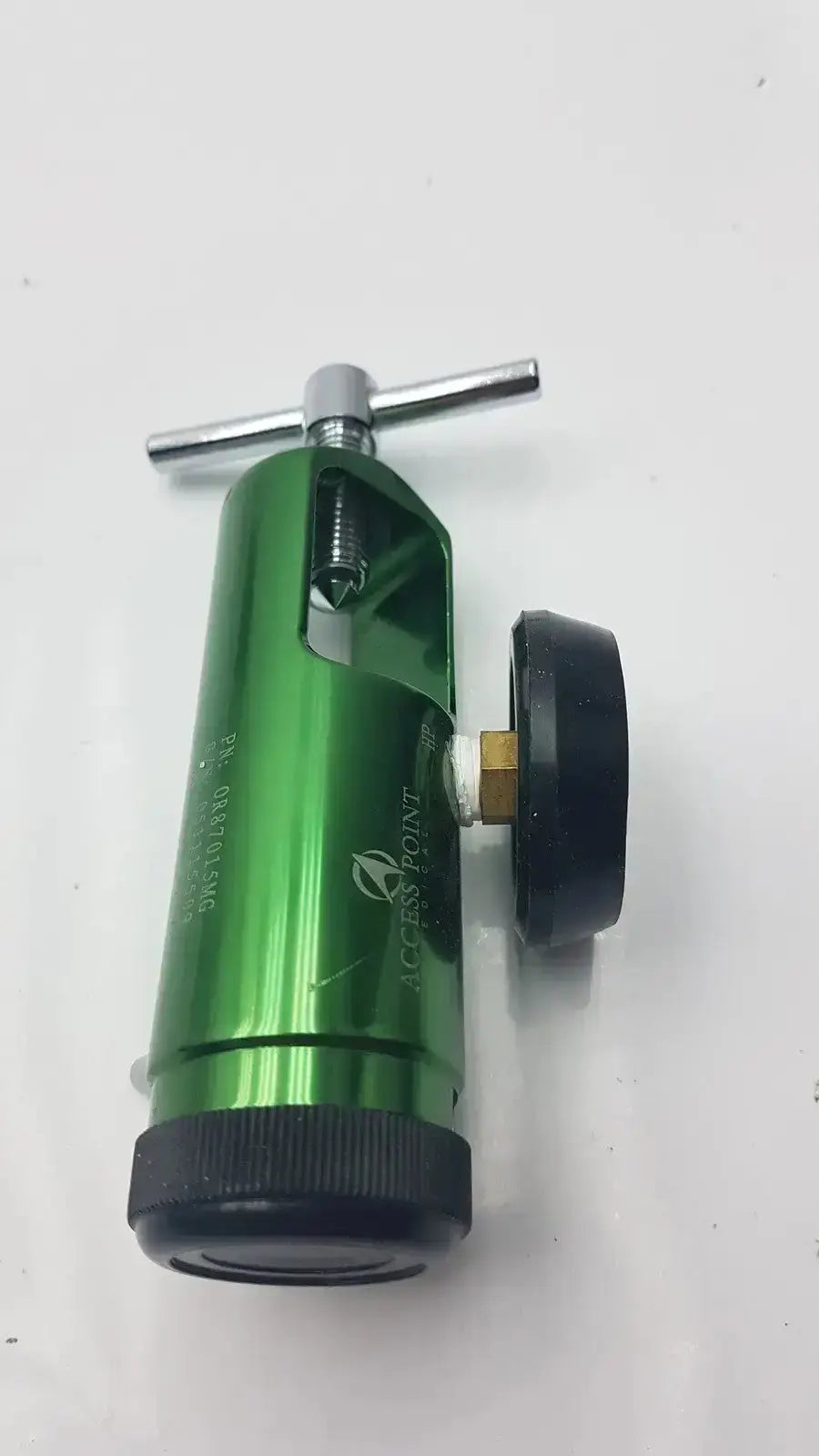Access point green metallic medical oxygen regulator with black rubber caps and silver adjustment knob