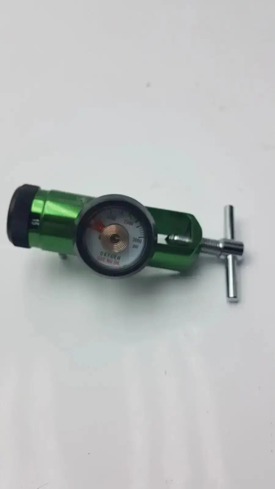 Green Access Point medical oxygen regulator with circular gauge and silver adjustment knob for medical oxygen control