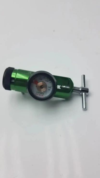 Green Access Point medical oxygen regulator with circular gauge and silver adjustment knob for medical oxygen control