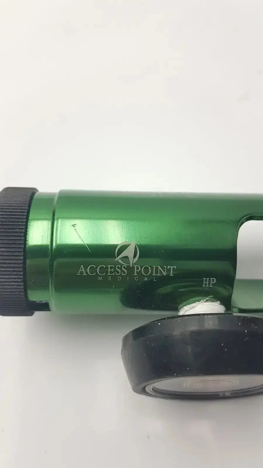 Green metallic medical oxygen regulator with black rubberized grip and access point medical branding for oxygen delivery