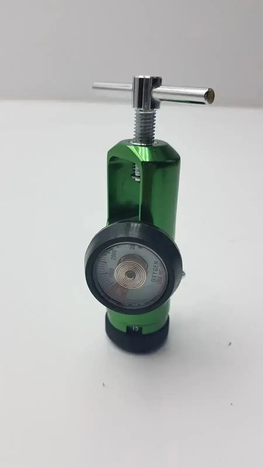 Green Access Point medical oxygen regulator with chrome adjustment knob and black pressure gauge for medical oxygen use