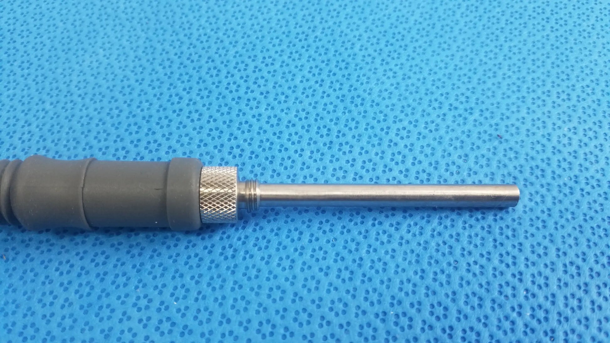Gray plastic-handled acclarent lgc2 fiber optic light guide cable with metallic adjustment knob and stainless steel shaft medical equipment