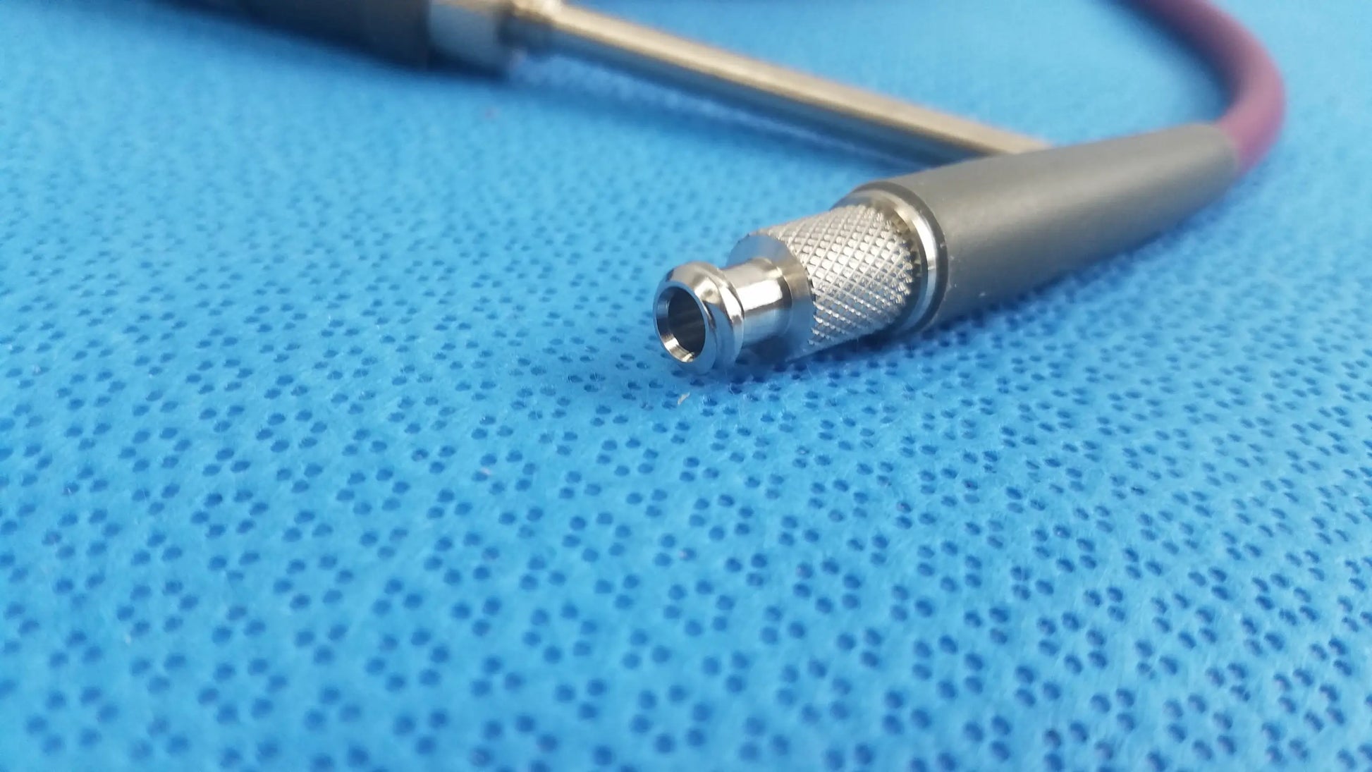 Gray and silver coaxial cable connector with textured metallic sleeve for acclarent lgc2 fiber medical equipment reuse