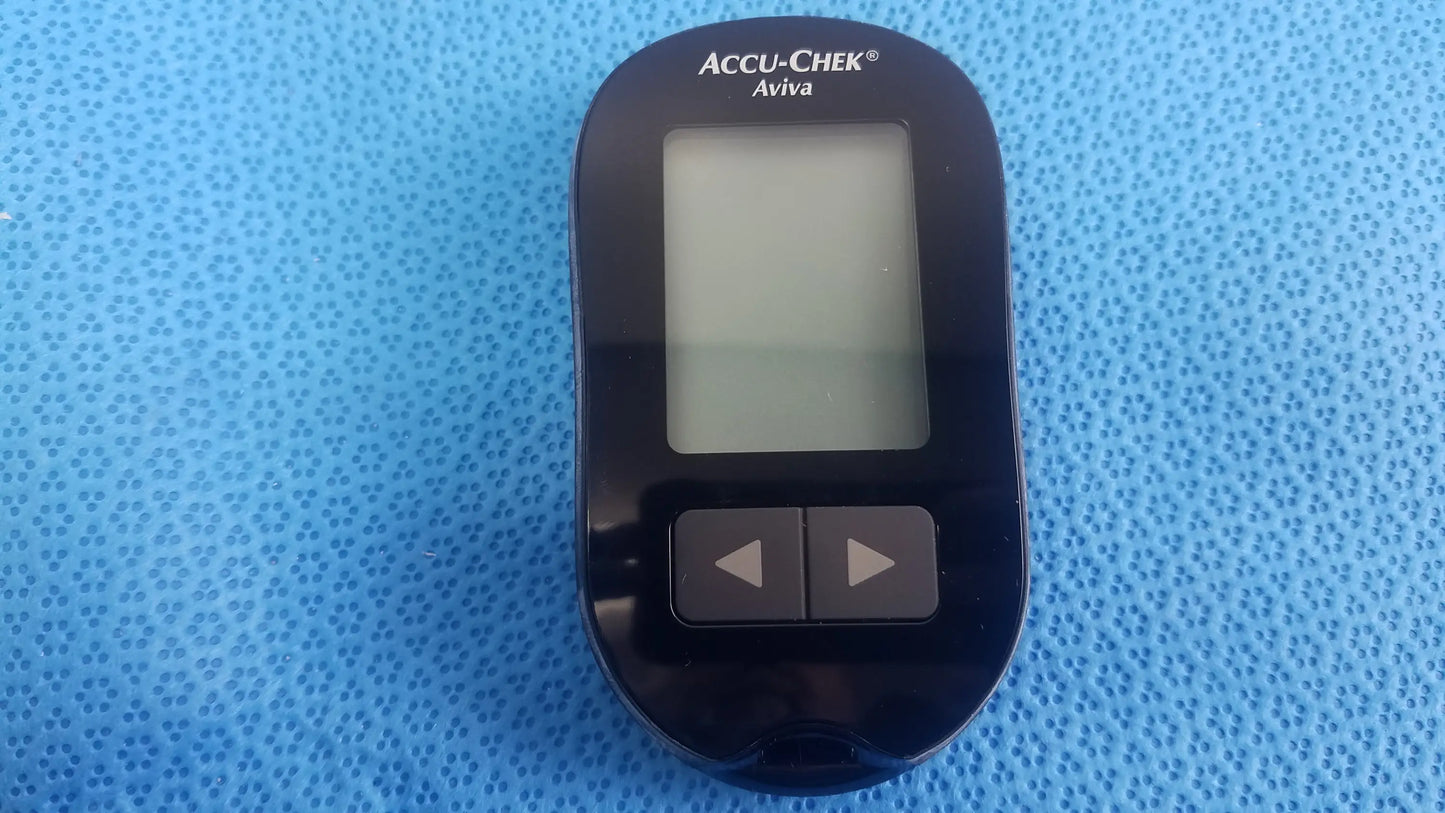 Black Accu Chek Aviva blood glucose meter with rectangular screen and two buttons in medical equipment kit with bag