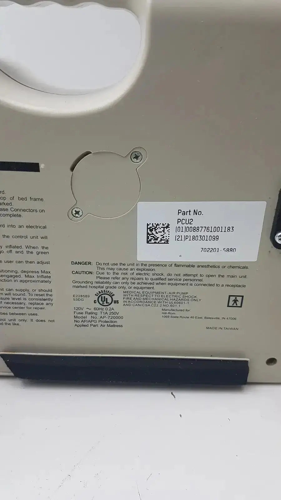 White plastic electrical unit with metal screw and label showing part number and voltage specs on accumax quantum convertible pressure redistribution system