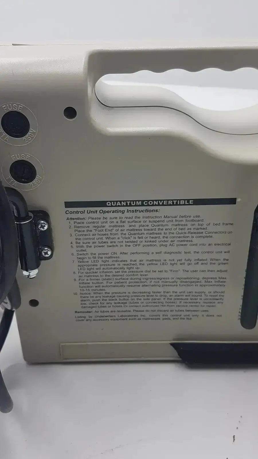 Black plastic control unit with labeled knobs and instructions for accumax quantum convertible pressure redistribution system