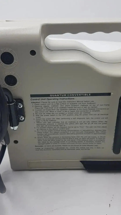 Black plastic control unit with labeled knobs and instructions for accumax quantum convertible pressure redistribution system