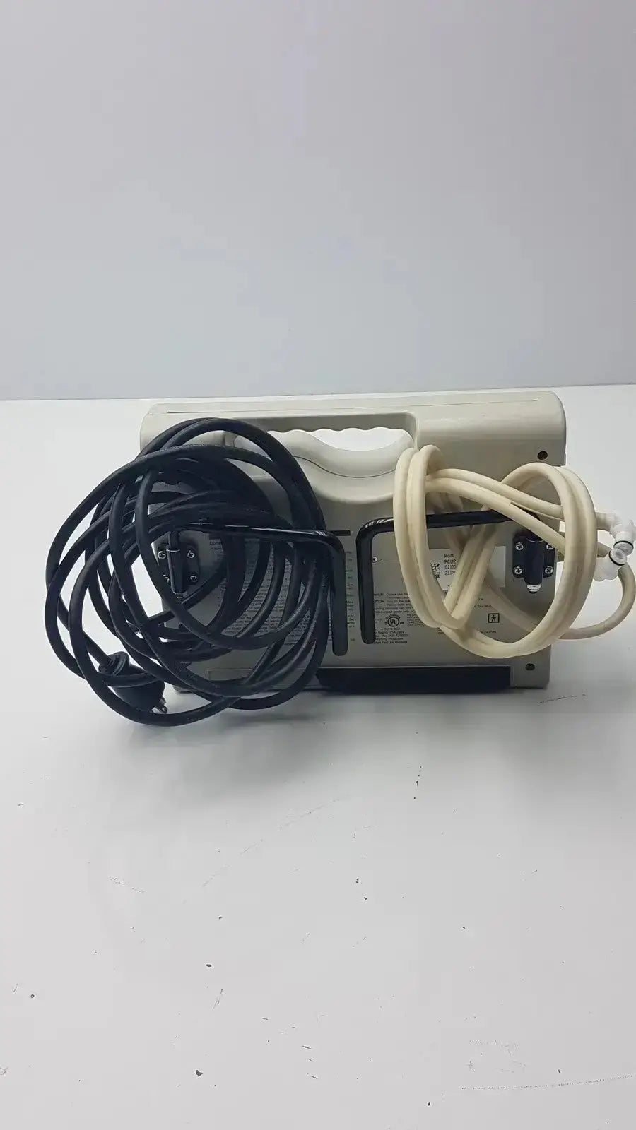 Beige plastic power supply unit with coiled black and cream cables for accumax quantum convertible pressure redistribution system