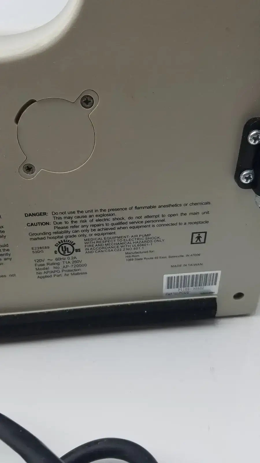 Beige accumax quantum convertible pressure redistribution air pump with black rubber base and metal mounting bracket