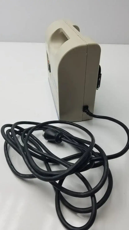 Beige plastic electric hair dryer with black power cord for accumax quantum convertible pressure redistribution system
