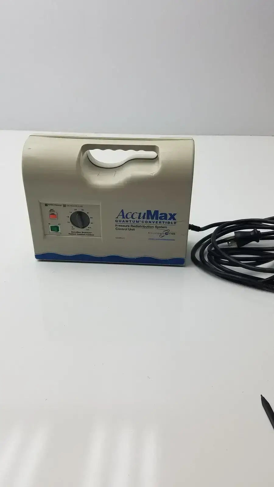 Beige accumax quantum convertible pressure redistribution system with blue wave design and black power cord visible