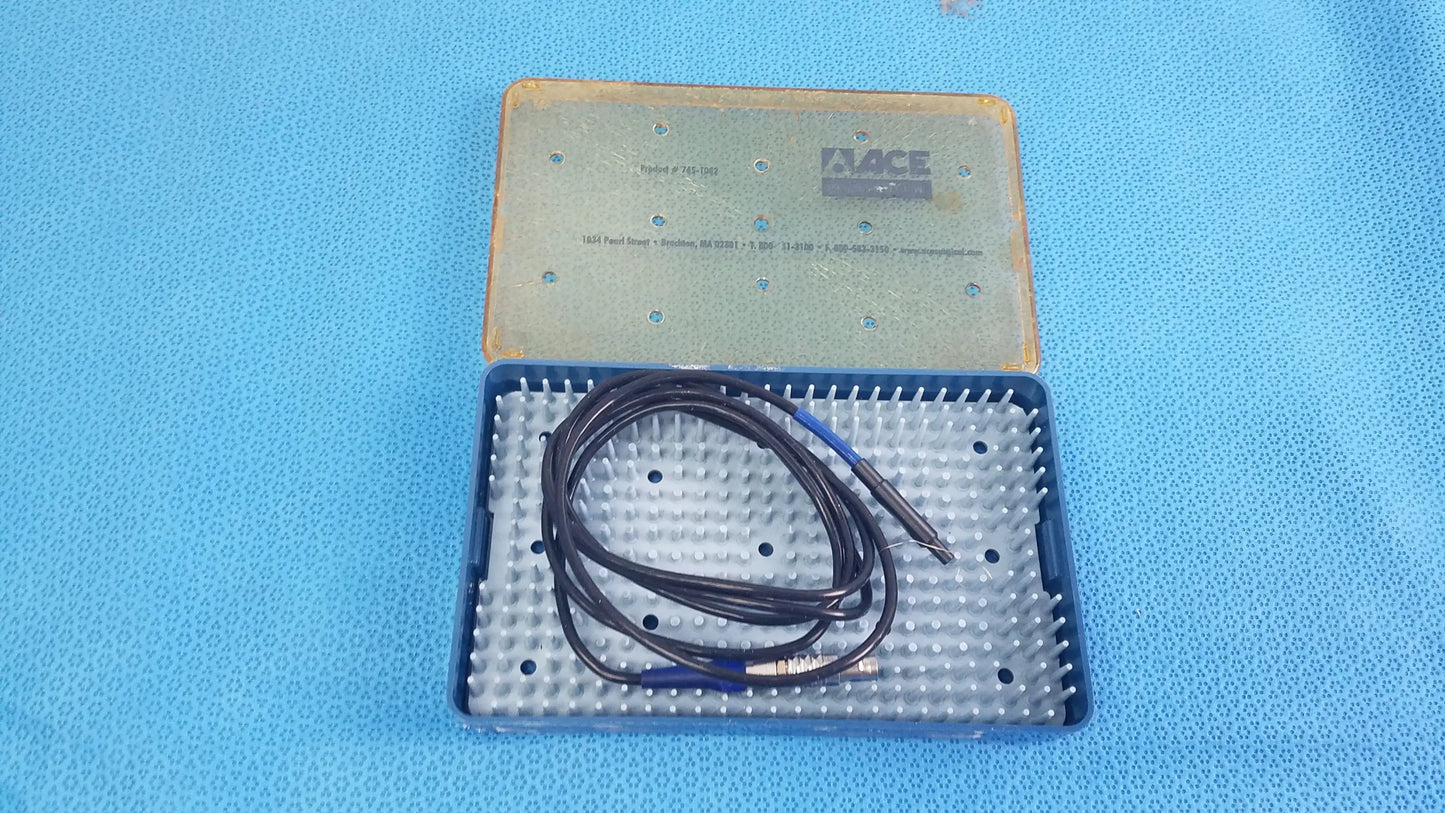 Black coiled cable with blue connectors in a blue and beige sterilization tray for Stryker multigen radiofrequency probe