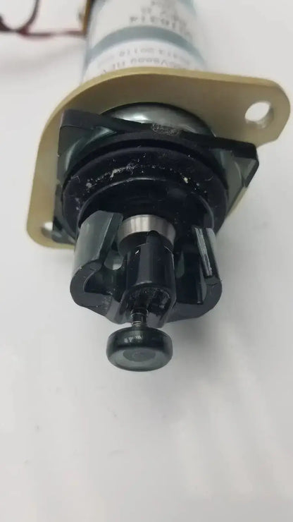 Black plastic and metal valve with a gold mounting bracket acro associates 955v8669 rev a associates 955v8669 rev