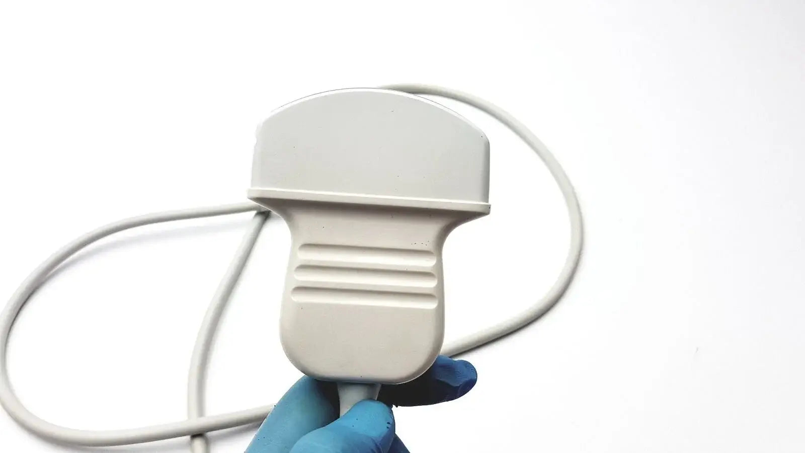 White ergonomic acuson c3 needle guide convex array ultrasound transducer probe with textured grip and coiled cable