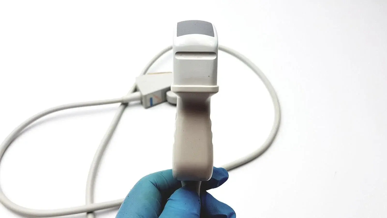 Gray Acuson C3 needle guide convex array ultrasound transducer probe with ergonomic grip and coiled white cable medical equipment