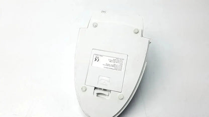 White plastic toilet seat cover with rectangular label and four circular mounts for adc advantage 6013 digital blood pressure monitor back side untested