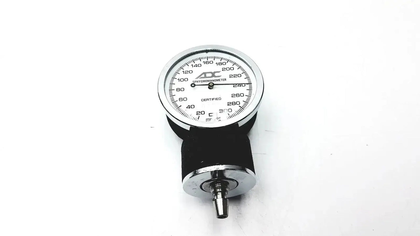Silver and black aneroid sphygmomanometer manual gauge with chrome casing and rubber cuff for blood pressure monitoring