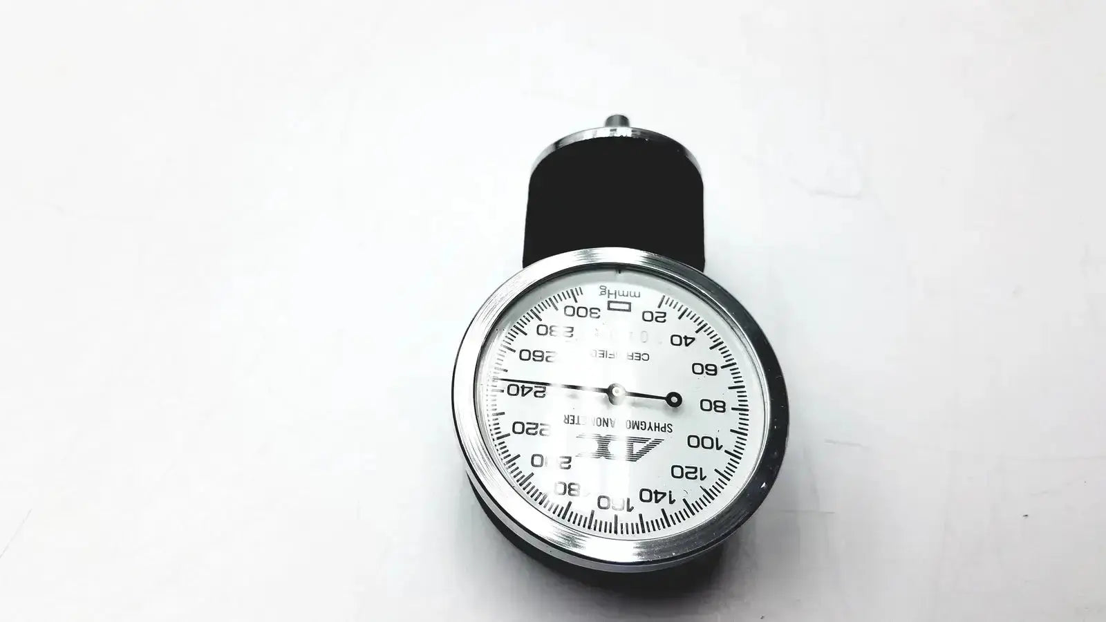 Silver-framed ADC gauge aneroid sphygmomanometer manual with black cuff and white dial marked in mmhg for accurate blood pressure monitoring