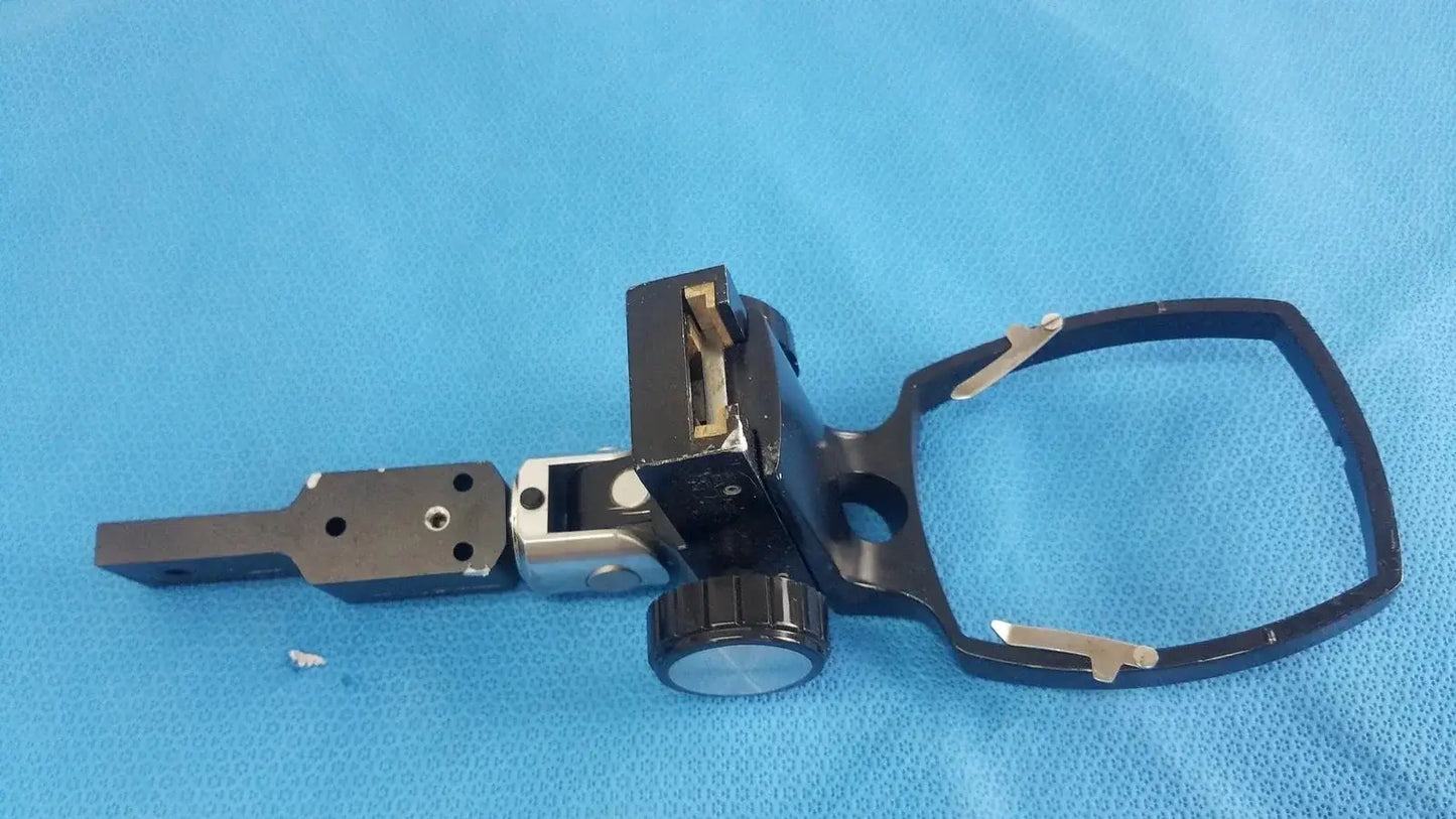 Black metal adjustable flash gun bracket with circular knob and rectangular mounting plate for reuse medical equipment