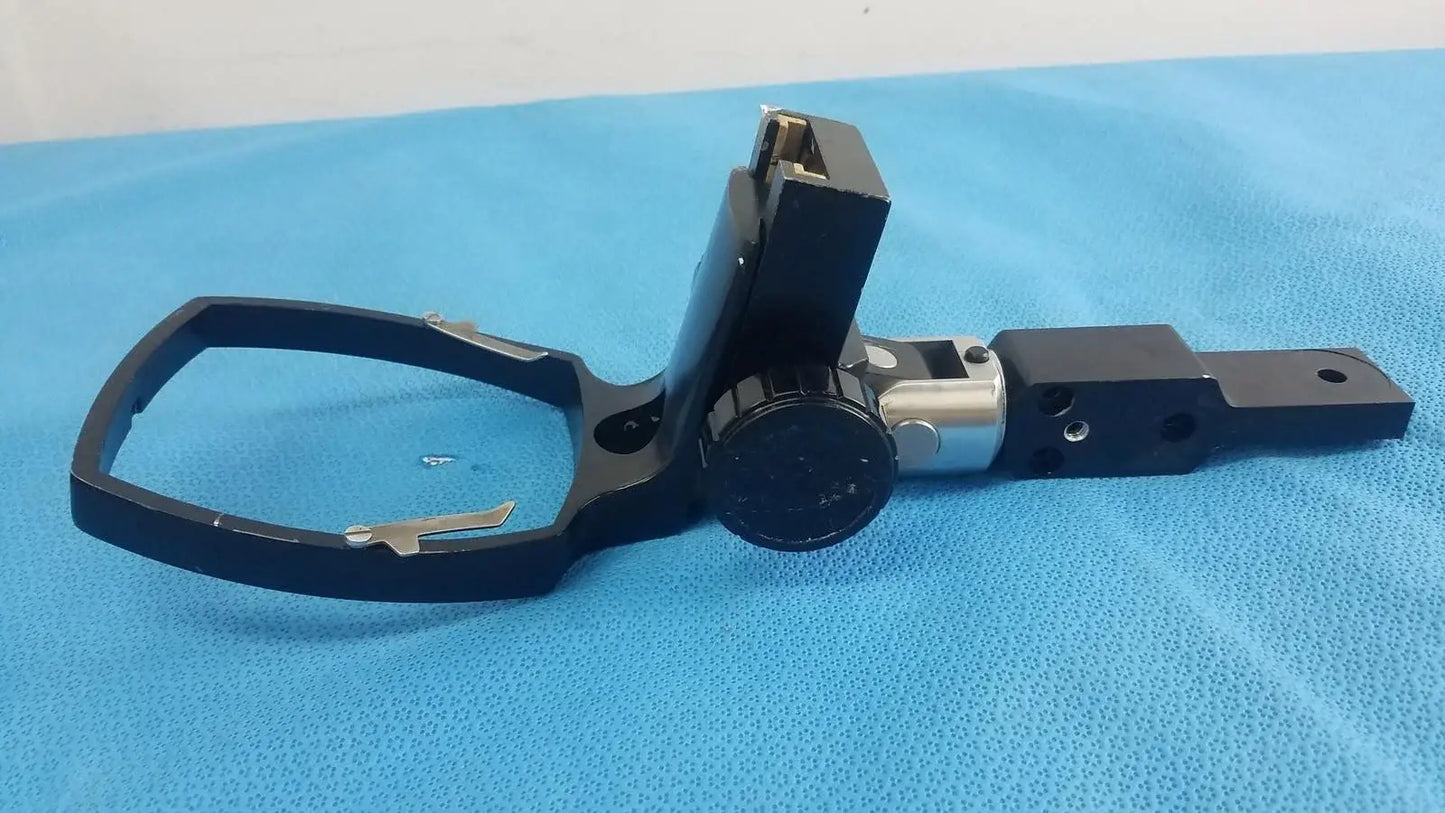 Adjustable flash gun bracket with black metal tripod mount, silver adjustment knob, and rectangular base plate for medical equipment reuse