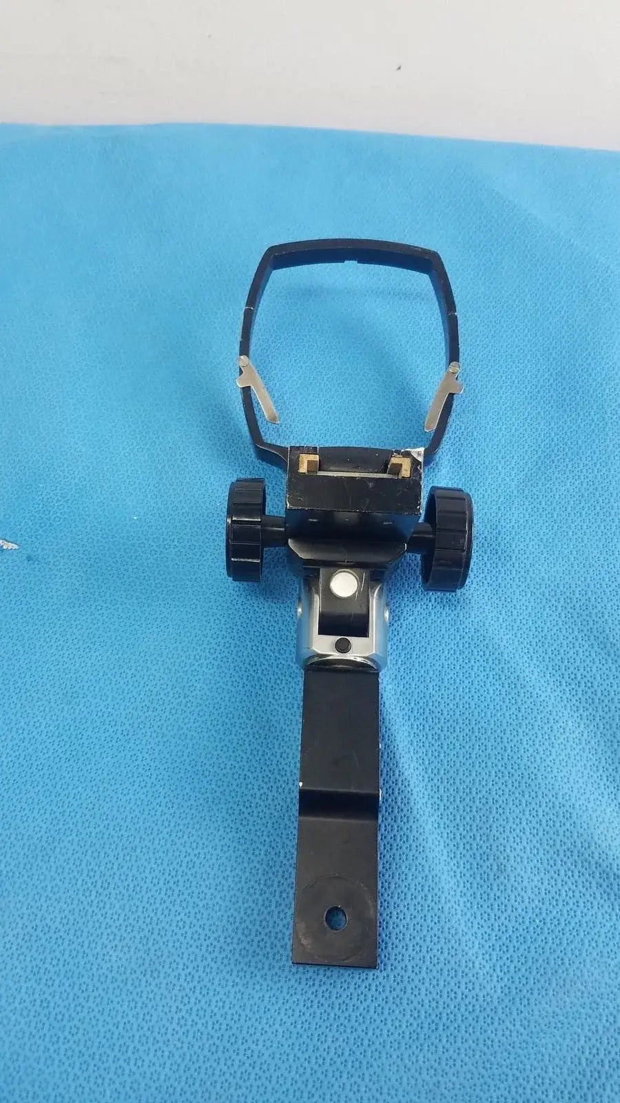 Adjustable flash gun bracket black plastic tripod mount with adjustable legs and circular clamp for medical equipment reuse