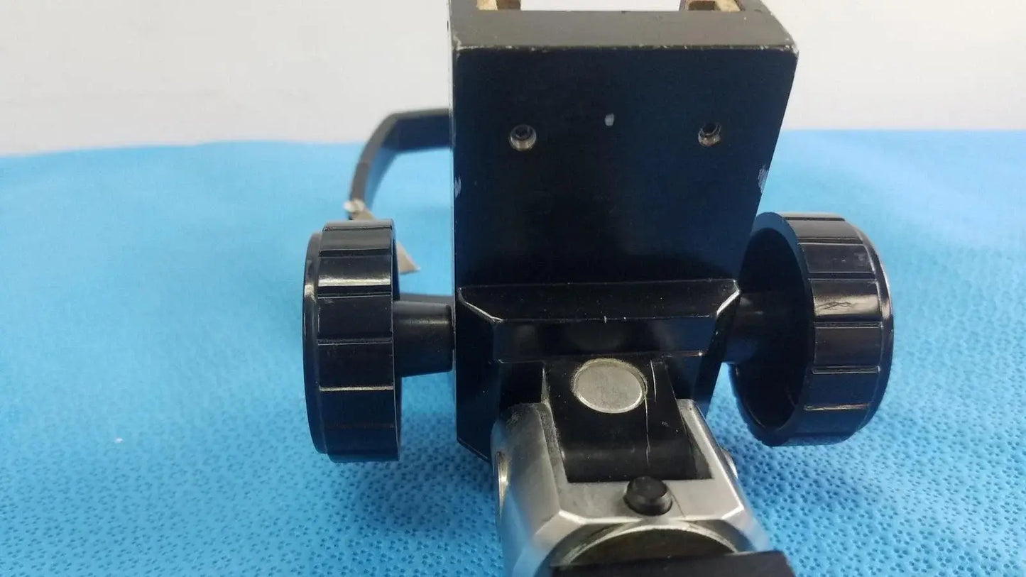 Adjustable flash gun bracket with black plastic and metal tripod head featuring textured knobs for reuse medical equipment