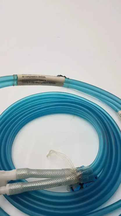 Blue translucent aiircast air comprressor hose with metallic mesh connectors and white label for compression devices