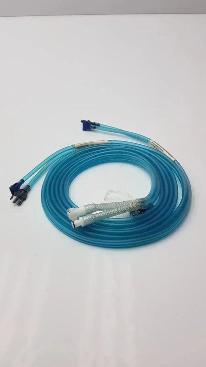 A coiled translucent blue aiircast air comprressor hose with multiple connectors and a textured white section for compression devices