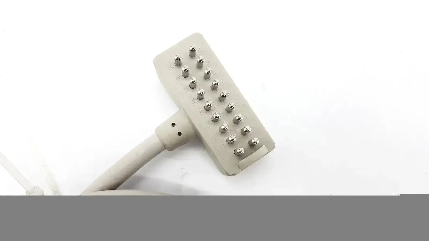 Gray plastic hair removal device with metallic pin grid for allen technologies curbell pillow speakers nurse call tv remote
