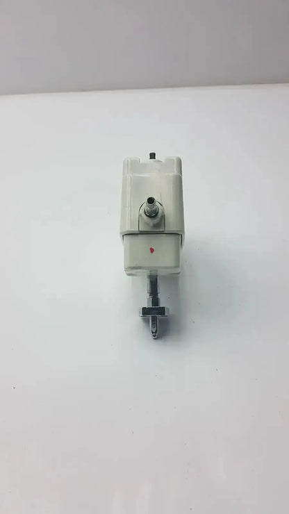 White plastic electric valve with metallic components and red dot on the side for allied healthcare vacutron suction regulator
