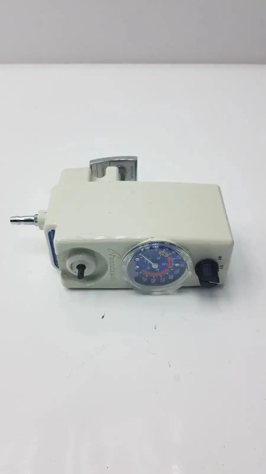 Off-white plastic allied healthcare vacutron 22-15-1208 suction regulator with circular gauge and metallic fittings