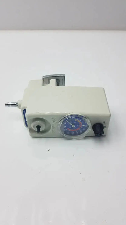 Off-white plastic allied healthcare vacutron 22-15-1208 suction regulator with circular gauge and metallic fittings
