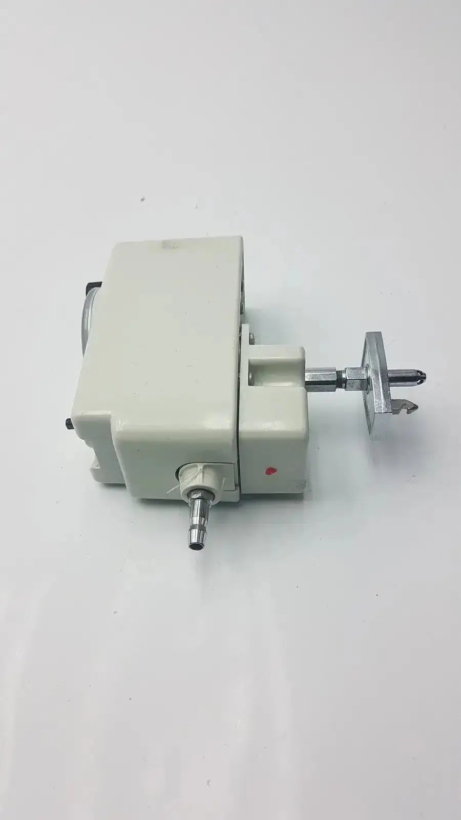 Off-white plastic housing with metallic shaft and red indicator dot on allied healthcare vacutron 22-15-1208 suction regulator