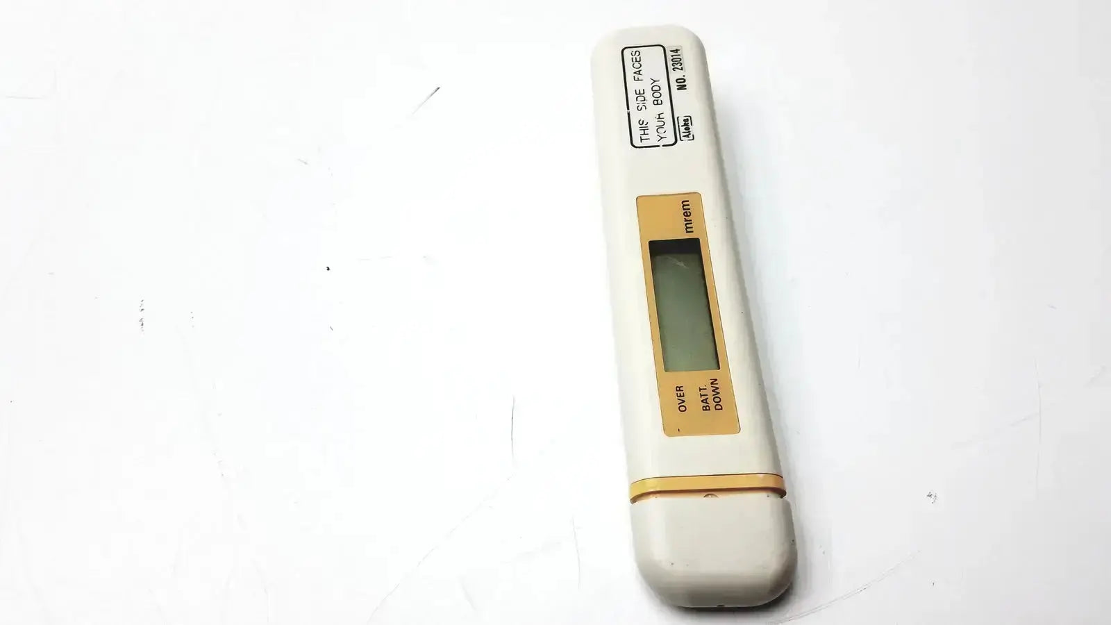 White digital mydose mini dosimeter with beige accent strip and small orange buttons by aloka pdm-253