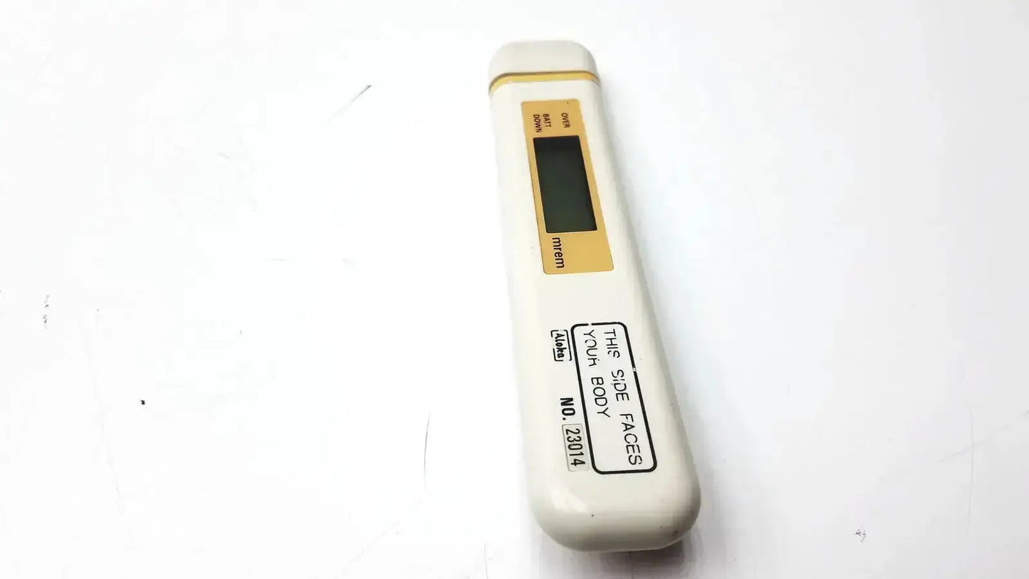 White digital mydose mini dosimeter with gold display panel and black text labeling aloka pdm-253 mydose mini dosimeter