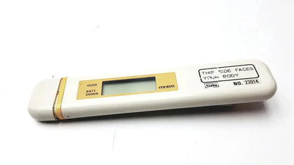 White and gold aloka pdm-253 mydose mini dosimeter with rectangular lcd screen displaying mrem for radiation measurement