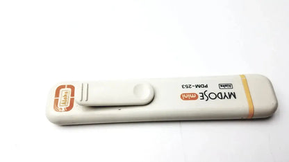 White plastic mydose mini dosimeter with orange branding and yellow stripe for blood glucose monitoring