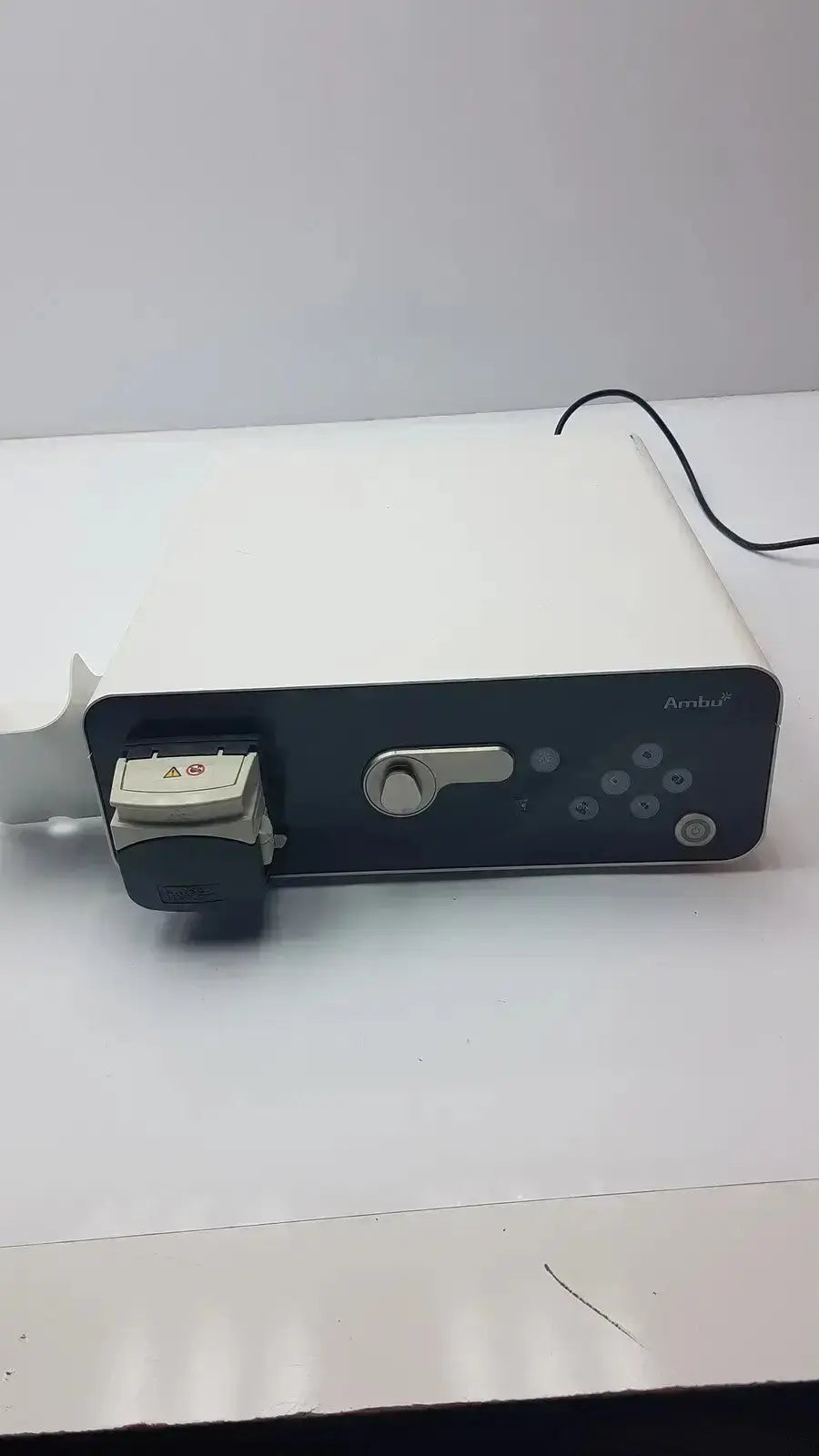 White and black medical device ambu abox duodeno with sleek rectangular design featuring control panel and keyhole