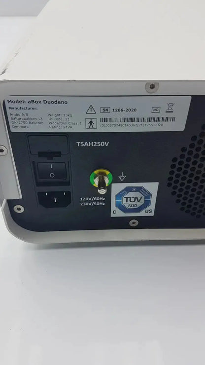 Back view of silver and black ambu abox duodeno network device with power input green status light and certification labels