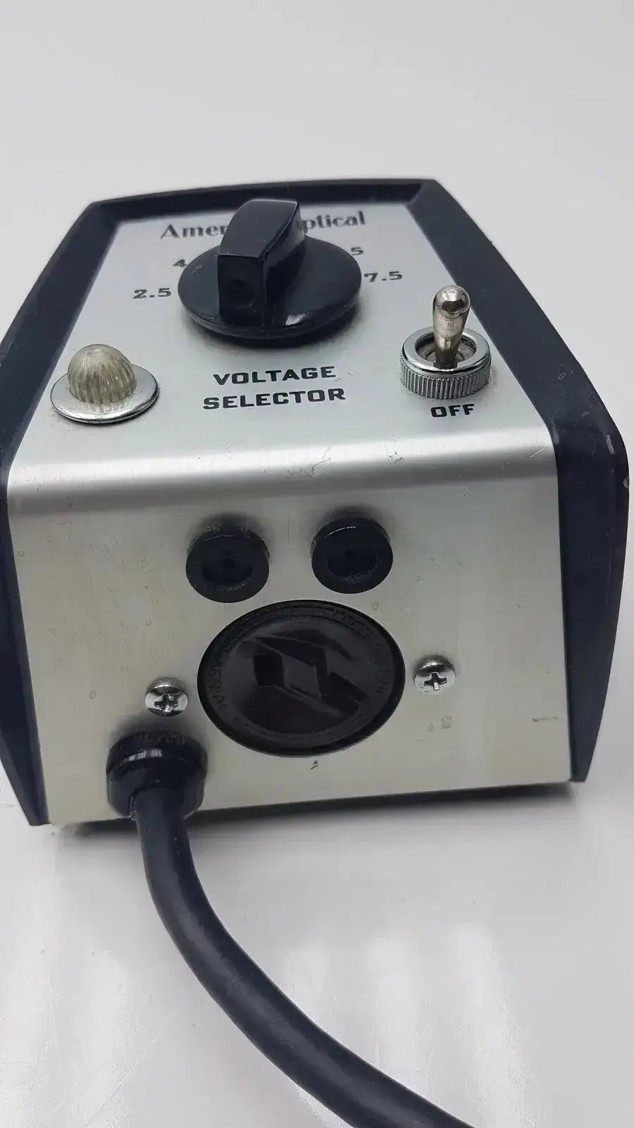 Silver and black American Optical voltage selector pri 115V with rotary dial toggle switch and power cord made in USA